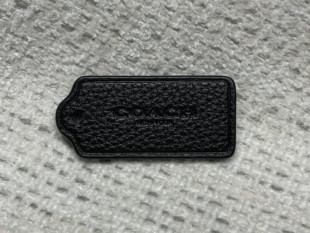 pre-owned authentic coach leather hang tag textured front view