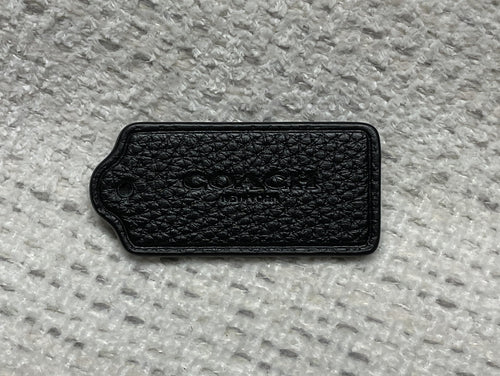 pre-owned authentic coach leather hang tag textured front view
