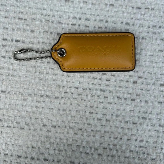 Coach 2.25 inch puffy beige  tag