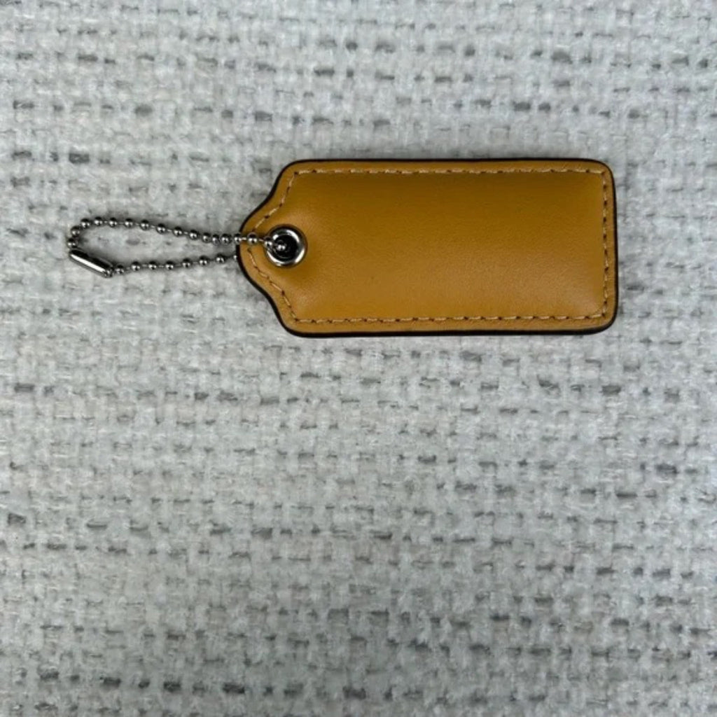 Coach 2.25 inch puffy beige  tag